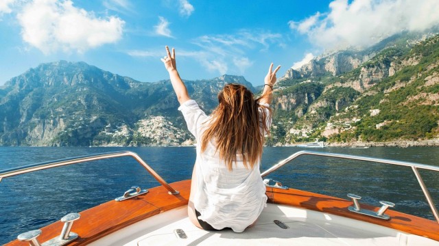 Guest enjoying the view from a boat on the Amalfi Coast